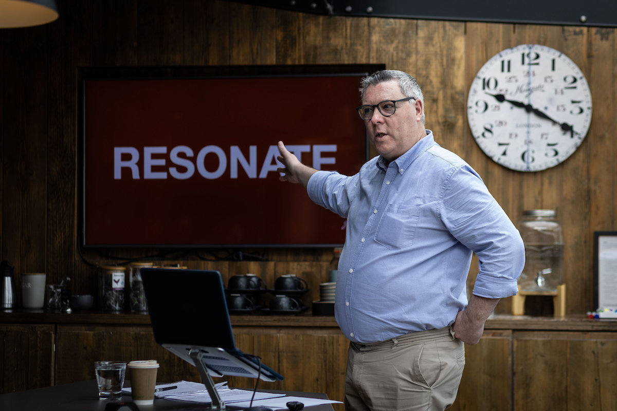 Gerry Forristal presenting, 'RESONATE' on screen